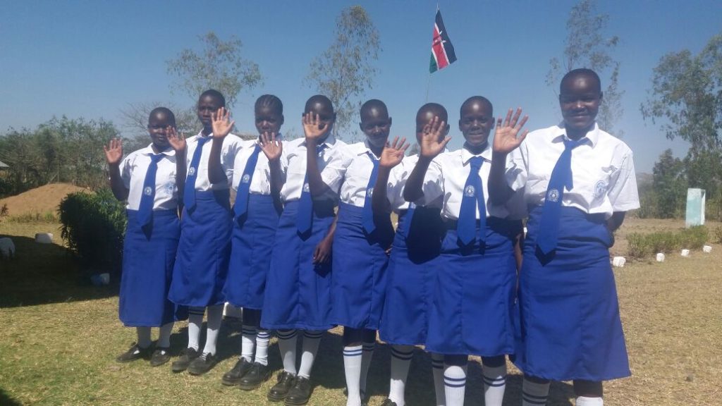 Image of STARS Children Africa high school girls in Kenya waving